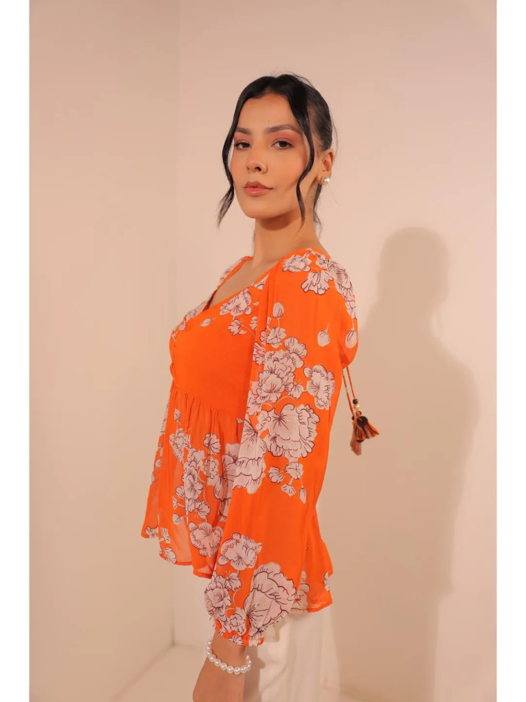 modish viscose georgette floral printed sweet heart center gathered busted, full puff sleeve, back tie-up top. - Orange