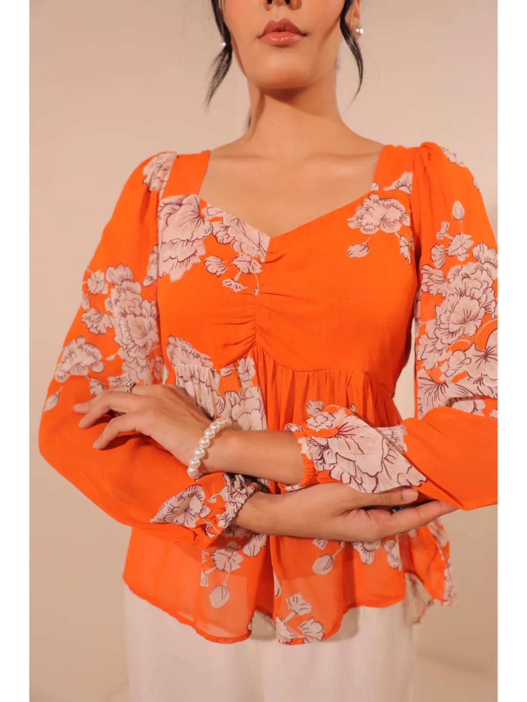 modish viscose georgette floral printed sweet heart center gathered busted, full puff sleeve, back tie-up top. - Orange