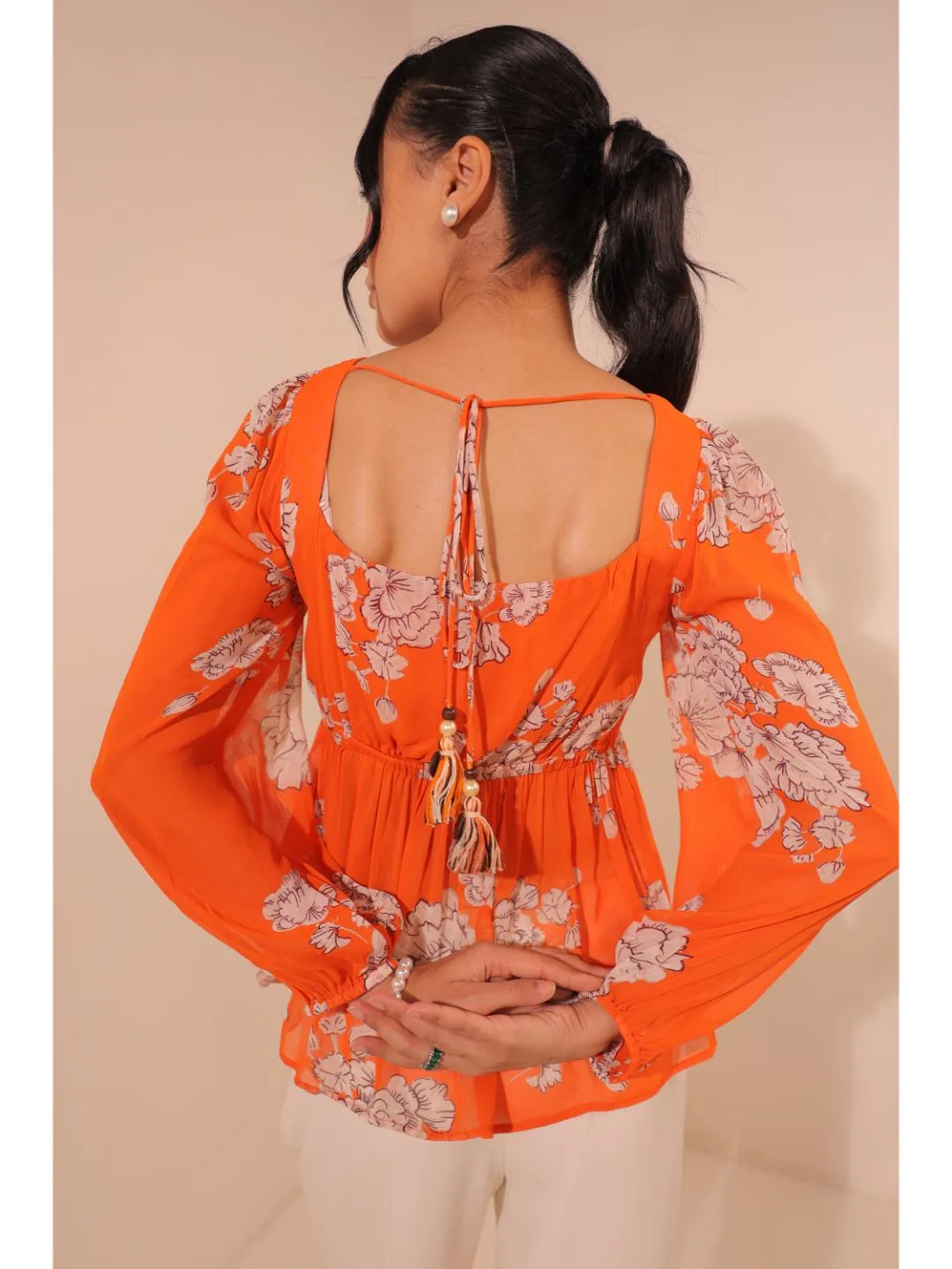 modish viscose georgette floral printed sweet heart center gathered busted, full puff sleeve, back tie-up top. - Orange